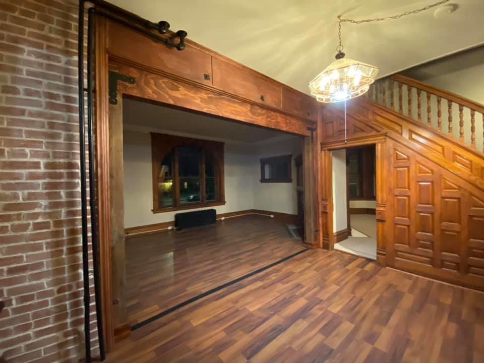 A room undergoing demolition and renovation with debris and tools by Contollo Field Services in Pueblo, CO