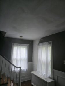A room showing walls and ceiling with drywall and plaster work in progress by N. Bennecoff Drywall & Plaster in Lancaster, PA.