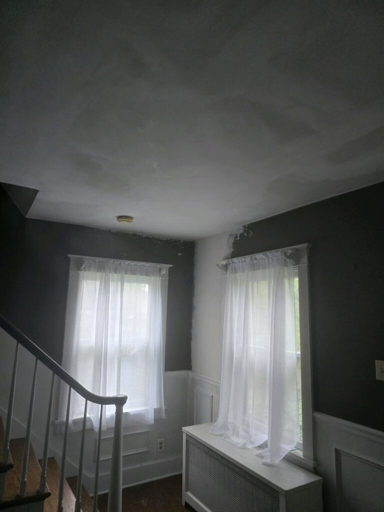 A room showing walls and ceiling with drywall and plaster work in progress by N. Bennecoff Drywall & Plaster in Lancaster, PA.