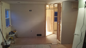 Room framing and partial drywall installation in progress, demonstrating handyman services by Precision Painters in Louisville, KY