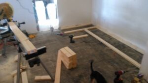 A room with wooden framing and tools, showing a carpentry project in progress by MG'S Services LLC in Albuquerque, NM.