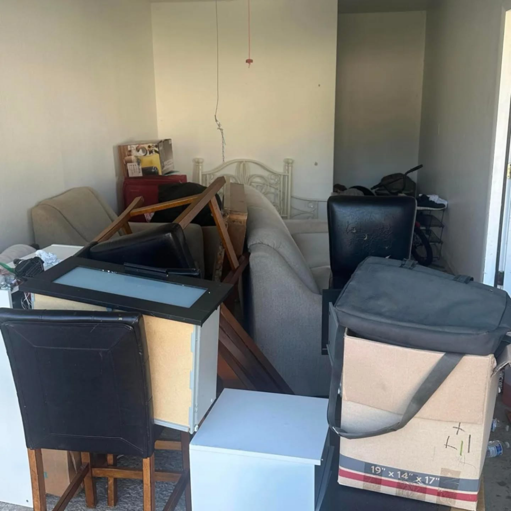 A room filled with various household junk and clutter ready for removal by 5 Star Junk Removal, LLC in Elyria, OH
