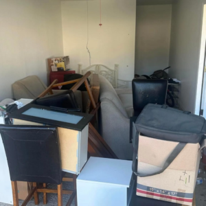A room filled with various household junk and clutter ready for removal by 5 Star Junk Removal, LLC in Elyria, OH