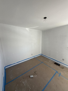 Room painting and light fixture installation services by Building Better Homes Management in Cincinnati, OH.
