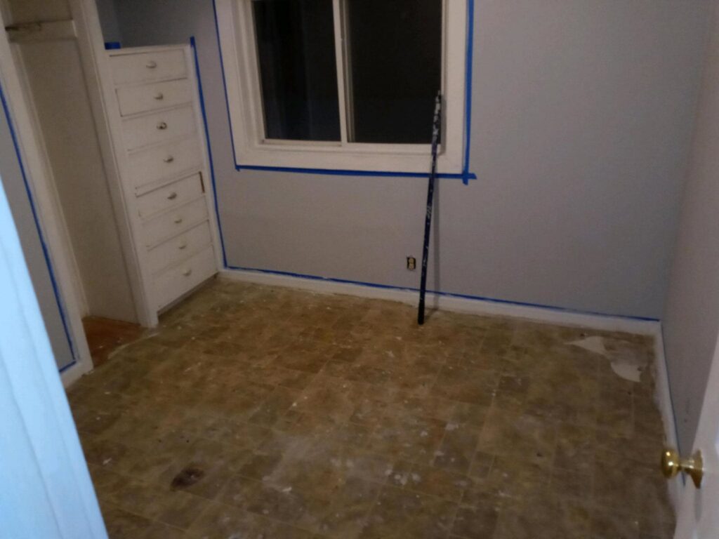 Room painting preparation with taped walls by Vermont Professional Solutions LLC in South Burlington, VT.