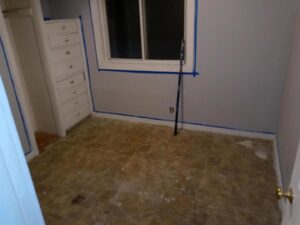 Room painting preparation with taped walls by Vermont Professional Solutions LLC in South Burlington, VT.