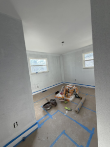 Room prepared for new flooring installation and painting services by Building Better Homes Management in Cincinnati, OH.