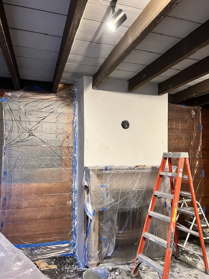 A room prepped with plastic sheeting for plastering work, a handyman service by Eric Aulbach Plastering in Saint Louis, MO.