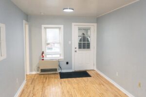 Room renovation with new door and heater installation by Vermont Professional Solutions LLC in South Burlington, VT.