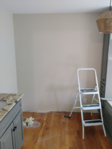 A room undergoing repair or renovation with a step ladder and vanity, demonstrating handyman services by Supernatural Drywall in Augusta, GA