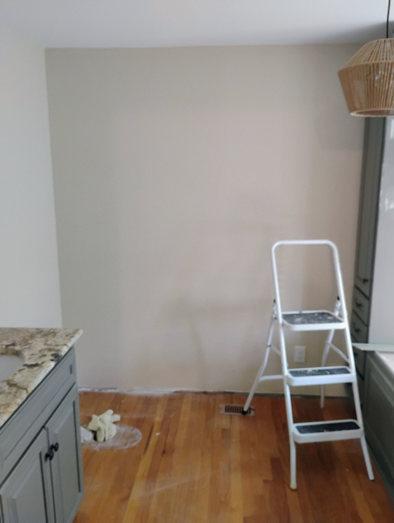 A room undergoing repair or renovation with a step ladder and vanity, demonstrating handyman services by Supernatural Drywall in Augusta, GA