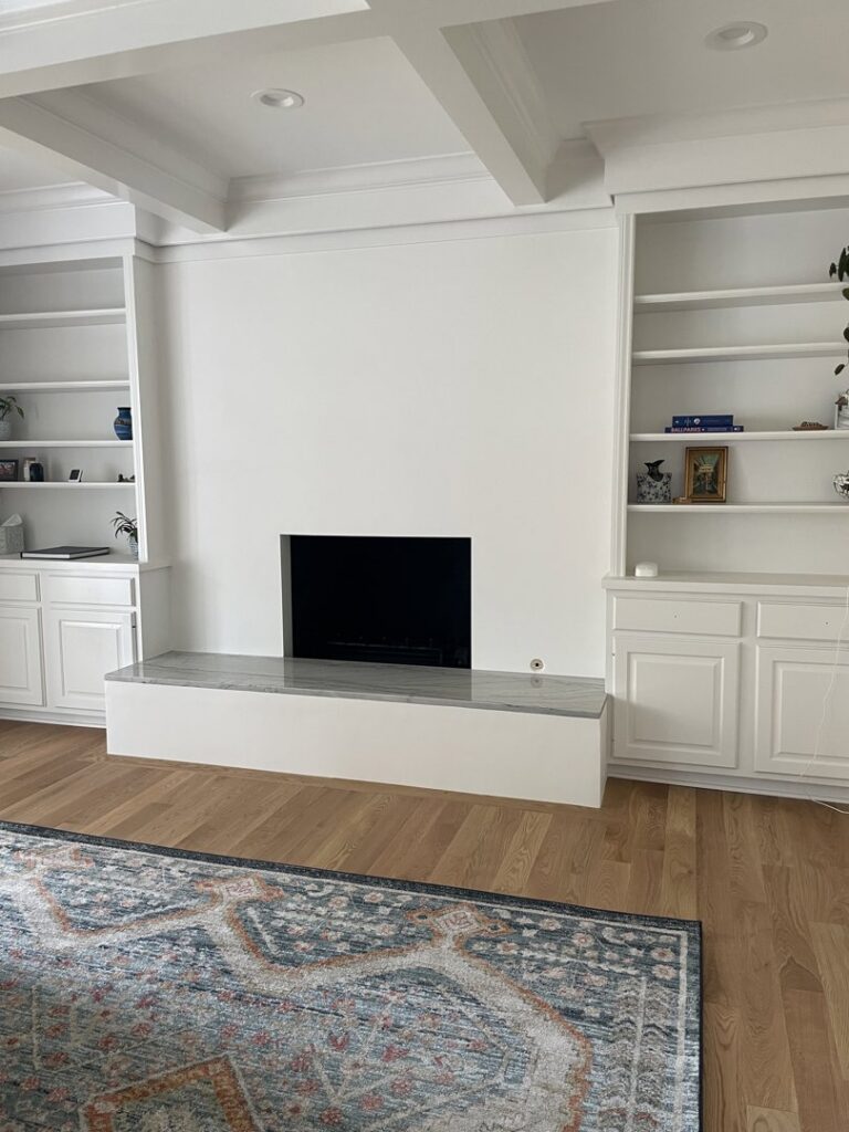 A finished room featuring wainscoting and ceiling panels, completed by Borrelli Plastering & Sons in O'Fallon, MO.