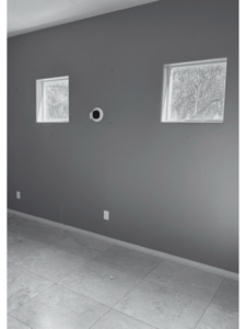 A room with electrical outlets and a smart home device installed by 180 Degrees Design + Build in Phoenix, AZ