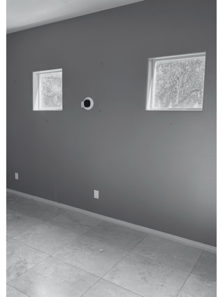 A room with electrical outlets and a smart home device installed by 180 Degrees Design + Build in Phoenix, AZ