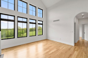 Room with large windows and pristine light hardwood floors by WoodHaven Floor Refinishing in Georgetown, KY.