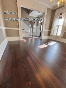 Royal mahogany hardwood floor stain applied by Trades by Taylor LLC, showcasing quality work in Huntsville, AL.