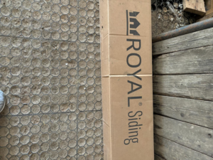 A box of Royal Siding materials for handyman services by E.L.Y Siding Company in Buckner, MO