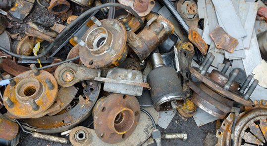 Close-up of rusty auto parts and scrap metal at Bailey Recycling and Scrap Metal in Topeka, KS