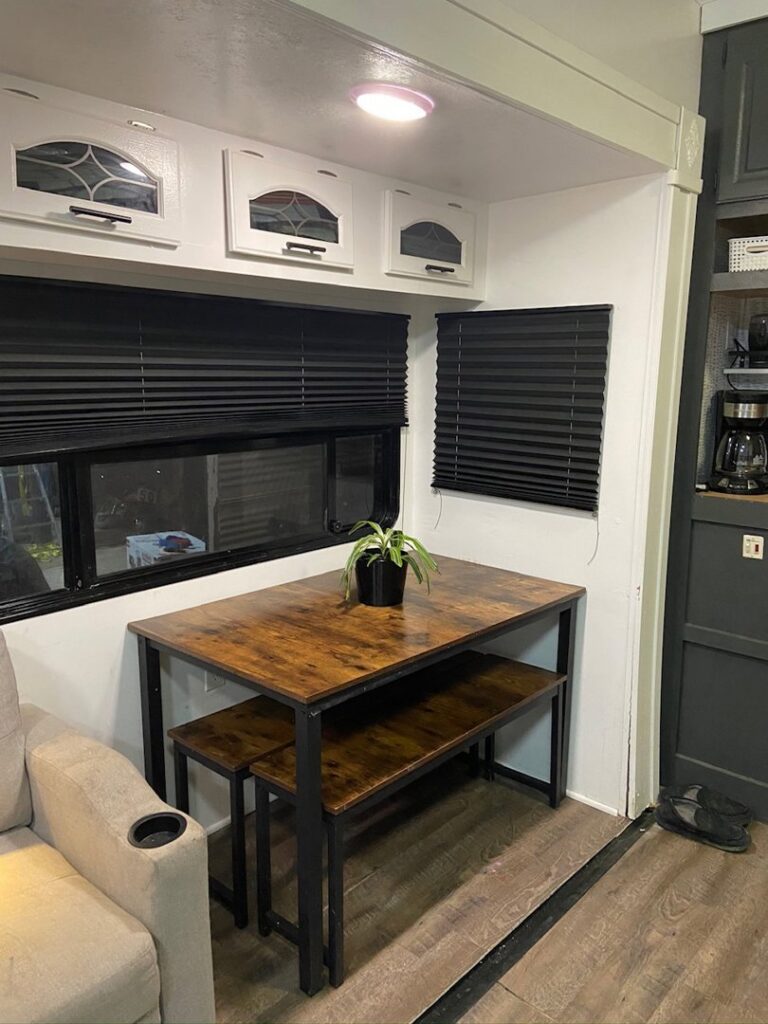 A renovated RV dining area with a custom table and benches, completed by The Sioux Falls Handyman in Sioux Falls, SD.