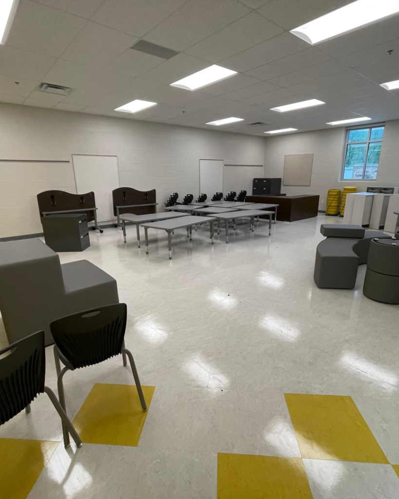 A school room with new tables, chairs, and storage units expertly arranged by Jez Enterprises in Aurora, CO.