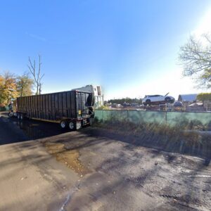 A large scrap hauling trailer at the salvage yard of First Class Auto Salvage Inc. in Trenton, NJ