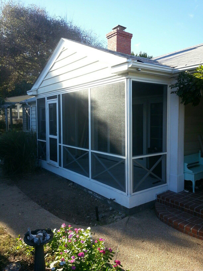 Newly constructed screened porch addition on a house by Coastal Contracting Services Inc. in Virginia Beach, VA.
