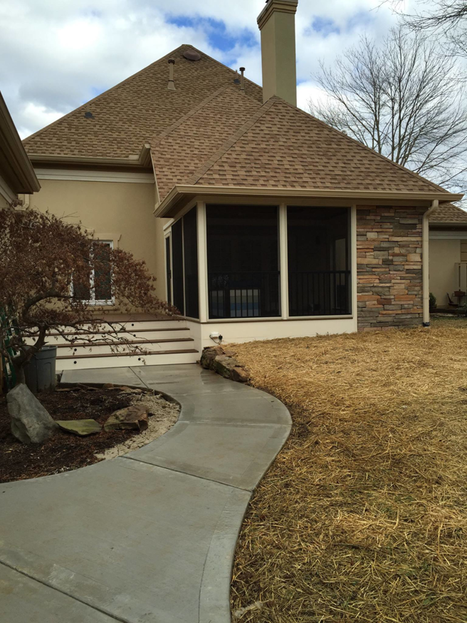 Newly constructed screened-in porch and concrete walkway by Tate Custom Builders in Knoxville, TN