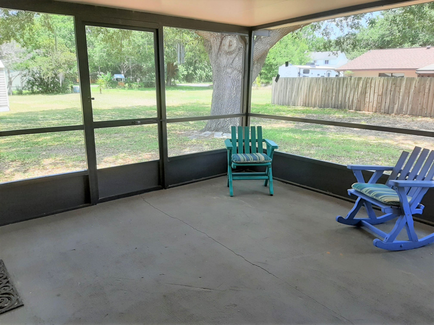 A spacious screened-in porch built by Knupper Properties & Knupper Homes, a general contractor in Clermont, FL.