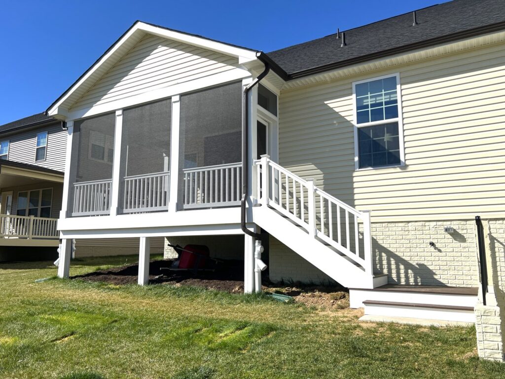 A newly constructed screened porch and deck on a home by Dream Design Build & Remodeling, Inc. in Baltimore, MD