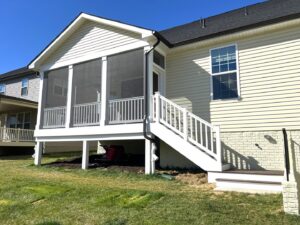 A newly constructed screened porch and deck on a home by Dream Design Build & Remodeling, Inc. in Baltimore, MD