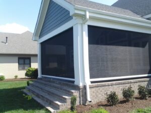 Exterior view of a completed screened porch on a house by The Home Pros in Carson, CA.