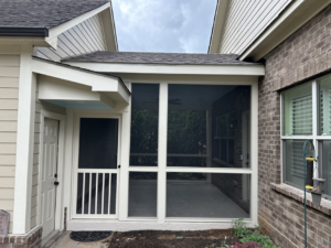 An exterior view of a home featuring a newly installed screened porch, completed by Safe Haven Home Services in Nashville, TN.