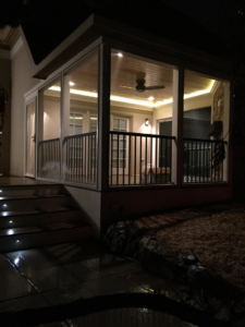 Beautiful interior lighting in a screened-in porch by Tate Custom Builders in Knoxville, TN