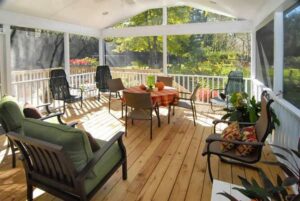A spacious screened porch with comfortable outdoor furniture by Rothrock Renovation & Remodeling in Winston-Salem, NC