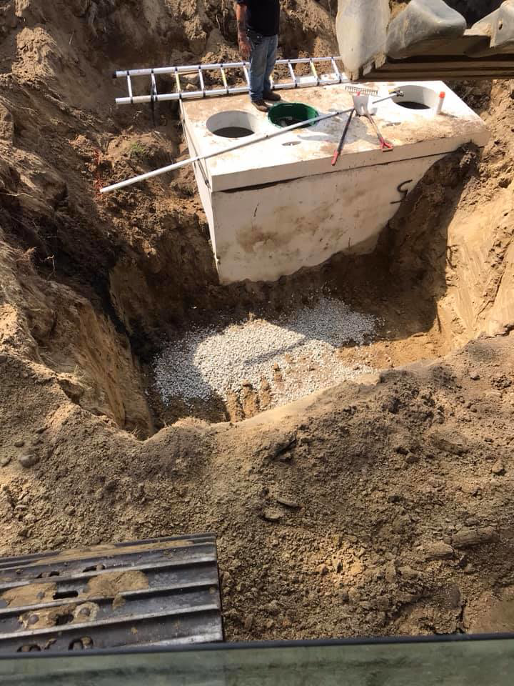 Excavation and installation of a septic tank by Us General, Inc. in Brockton, MA.
