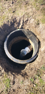 An open trench showing a sewer line access point for Advanced Rooter Plumbing in Norwalk, CT