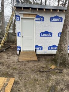 Shed under construction with new door and ramp by Sanchez & Hall Construction in Richmond, VA.
