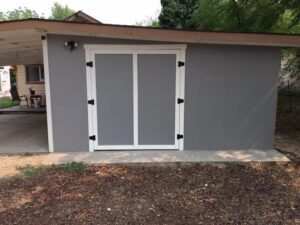 New double doors installed on a shed, part of an exterior update by Rod's Handyman Services, LLC in Boise, ID.