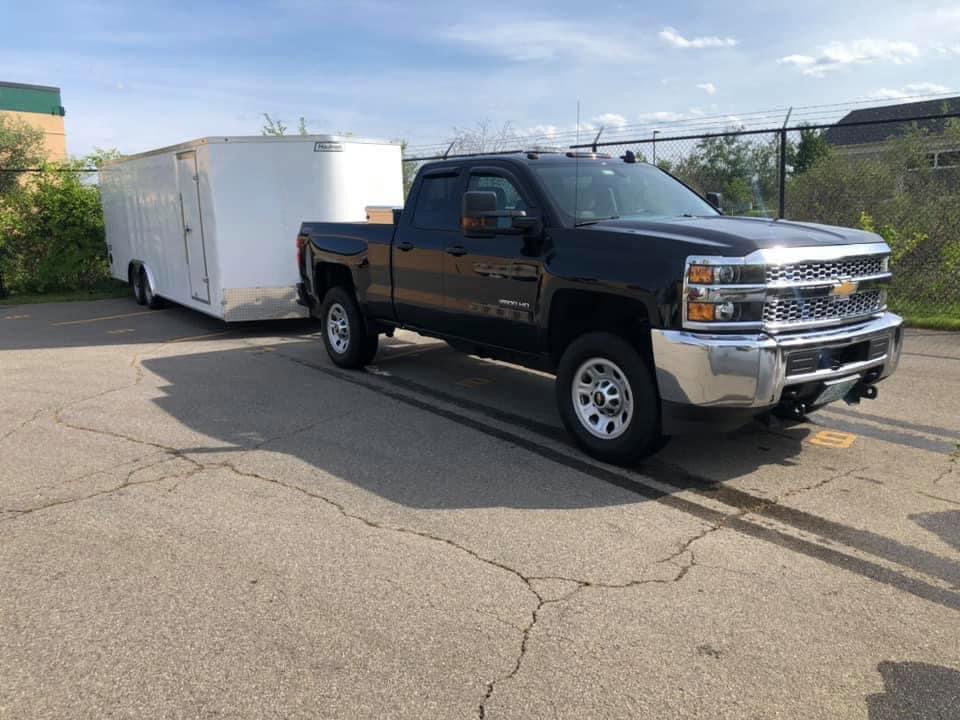The interior of a shed filled with boxes and various items, indicating a shed cleanout job by Tj's junk removal LLC in Derry, NH.
