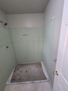 Completed installation of shower backer board and prepared shower pan base by Fullhouse Builders LLC in Gig Harbor, WA