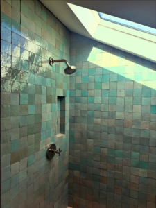 Expert shower head and faucet installation with custom tiling by Sweeney Restoration, LLC in New Orleans, LA.