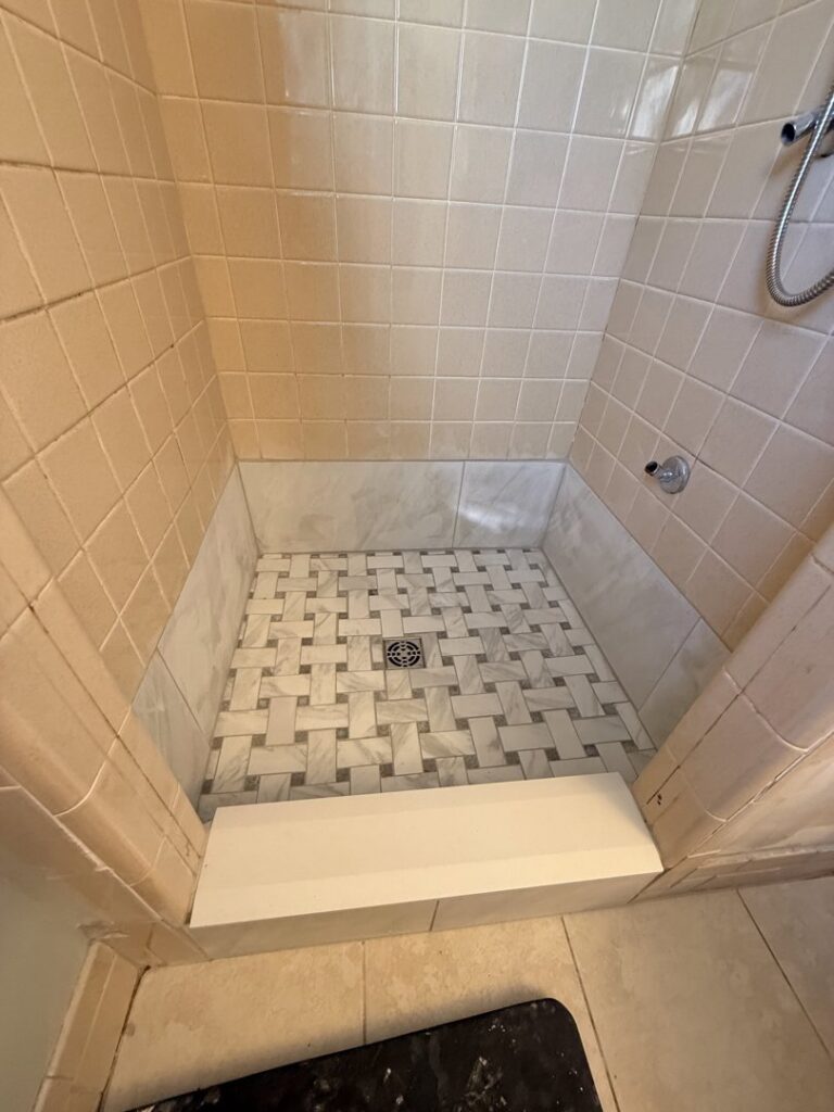 New tile installation in a shower stall, showcasing a tiling project by Handy Fix Co. in Cleveland, OH.