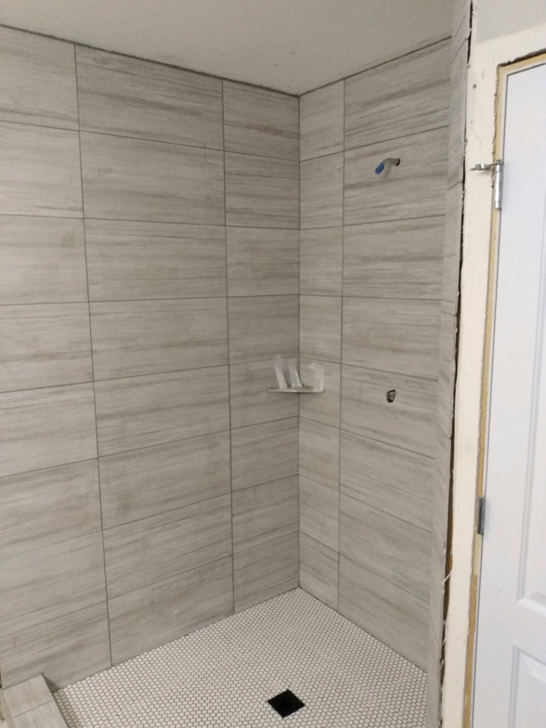 Newly installed shower wall and floor tiling by J & D Home Innovations in West Jordan, UT