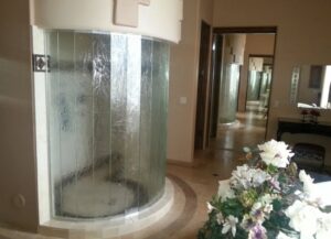 A shower and tub combination with new tiling and a glass enclosure by Southwest Restoration & Design, Inc. in Peoria, AZ.