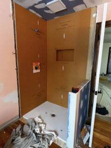 Shower waterproofing panels and pan installed during a bathroom renovation by Fine Line Painting and Design in Georgetown, KY.