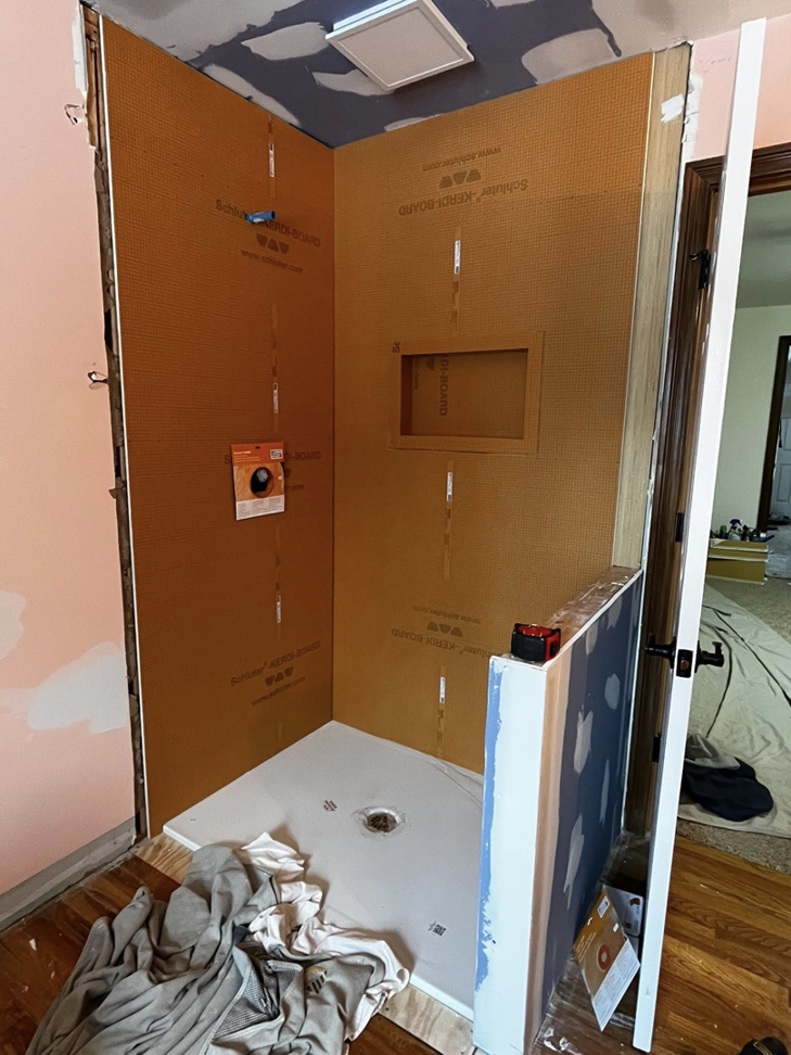 Shower waterproofing panels and pan installed during a bathroom renovation by Fine Line Painting and Design in Georgetown, KY.