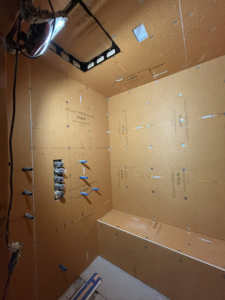 Shower waterproofing installation with Schluter-KERDI-BOARD and plumbing rough-ins by Michael South Home Renovations in Fort Worth, TX.
