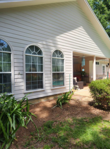 Side house exterior painting and renovation including a covered patio area by Oseguera Painting, LLC in Tallahassee, FL