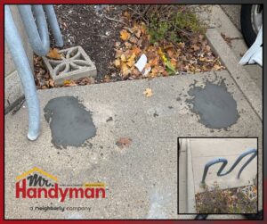 Concrete patching on a sidewalk next to bike racks by Mr. Handyman of Waukesha and North Milwaukee County, WI.
