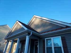Close-up of new siding, gutters, and roofline on a house by NC Siding and Windows in Raleigh, NC